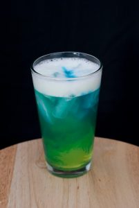 Banana Liqueur & Pineapple Mixed Drink with Blue Curaçao